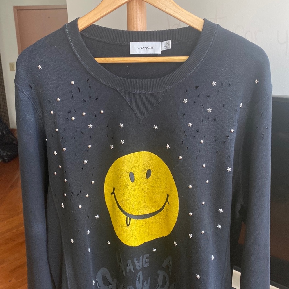 Coach sweater with distressing